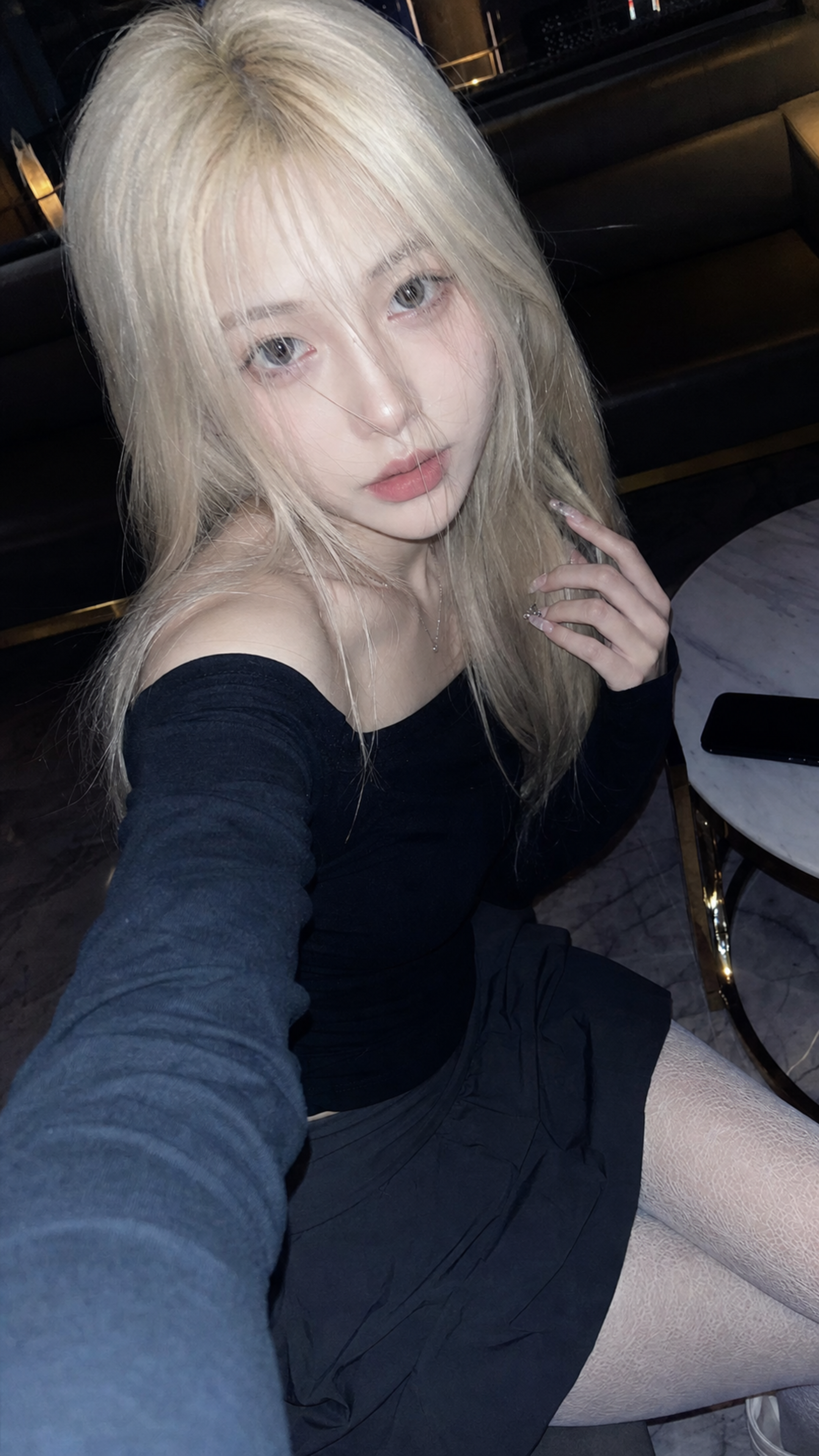A realistic vertical 9:16 phone selfie, 